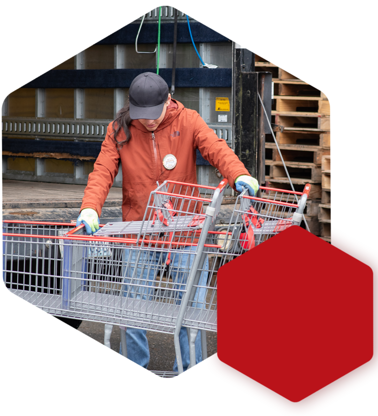 staff filling grocery cart with food