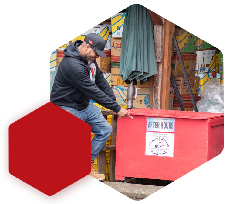 chris pointing to donate after hours box
